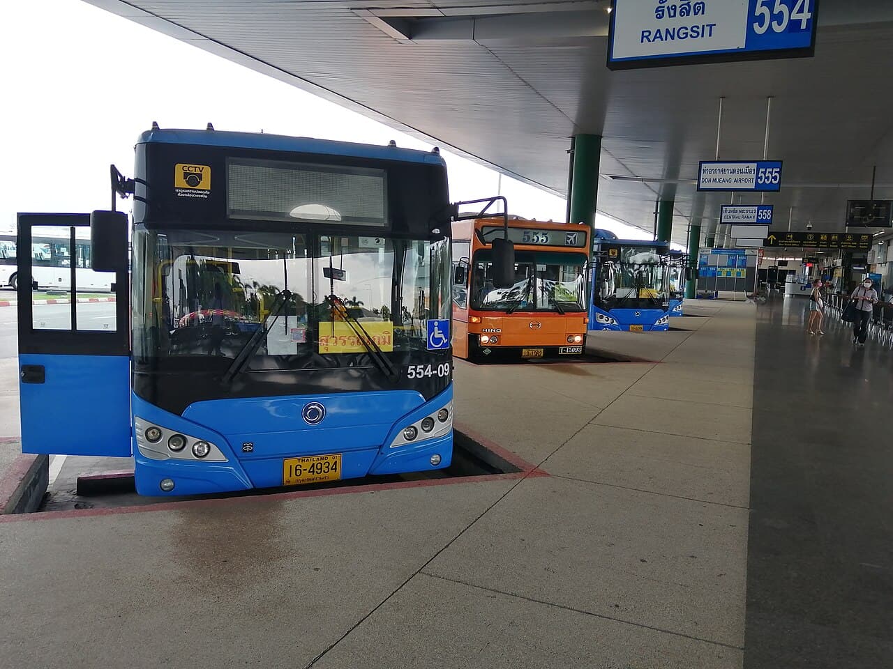 Buses and bay signs at Suvarnabhumi Airport bus terminal.